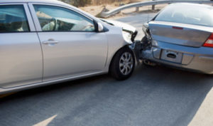 Two cars in collision on roadway